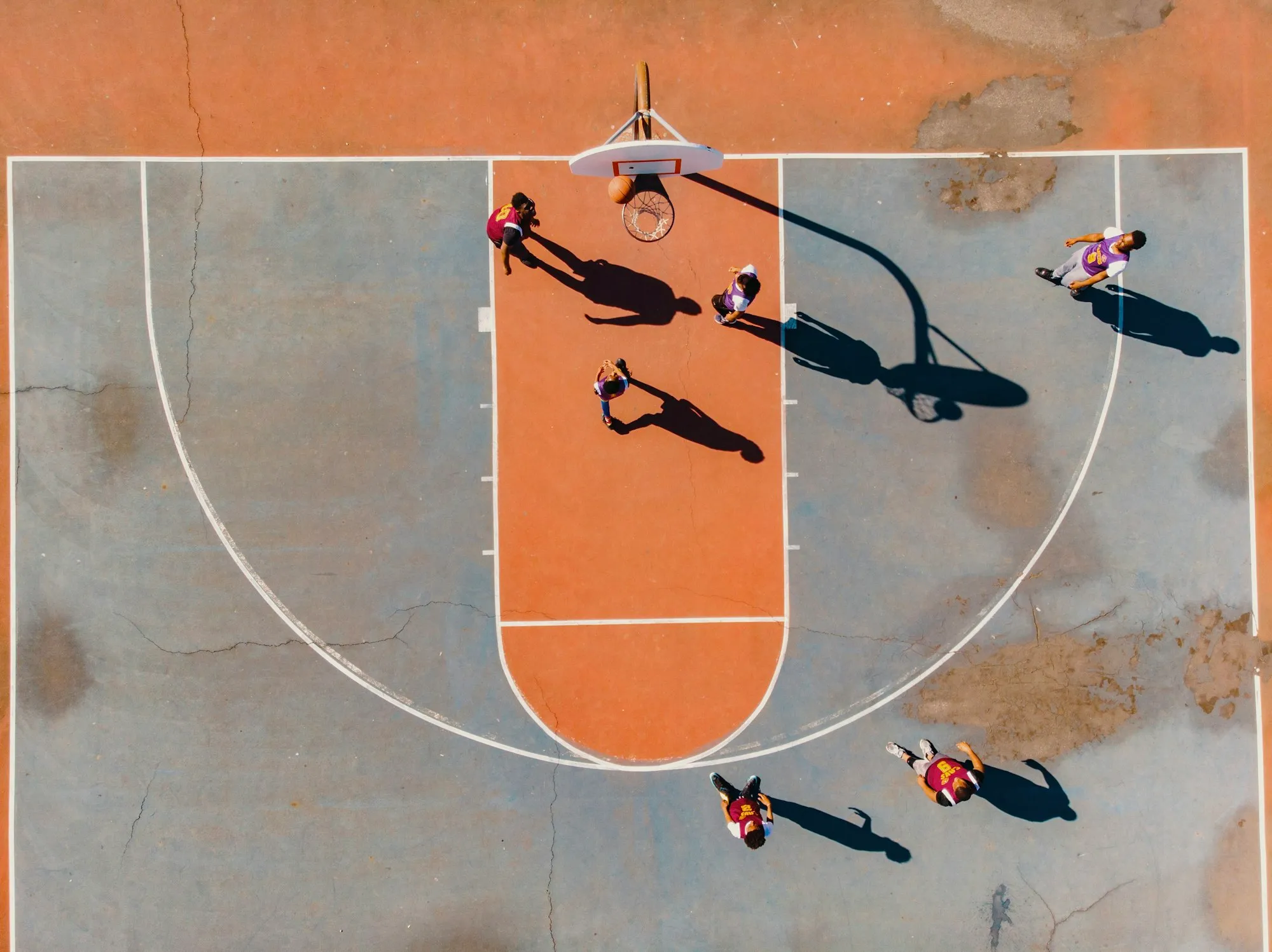 Overhead view of a basketball court in play