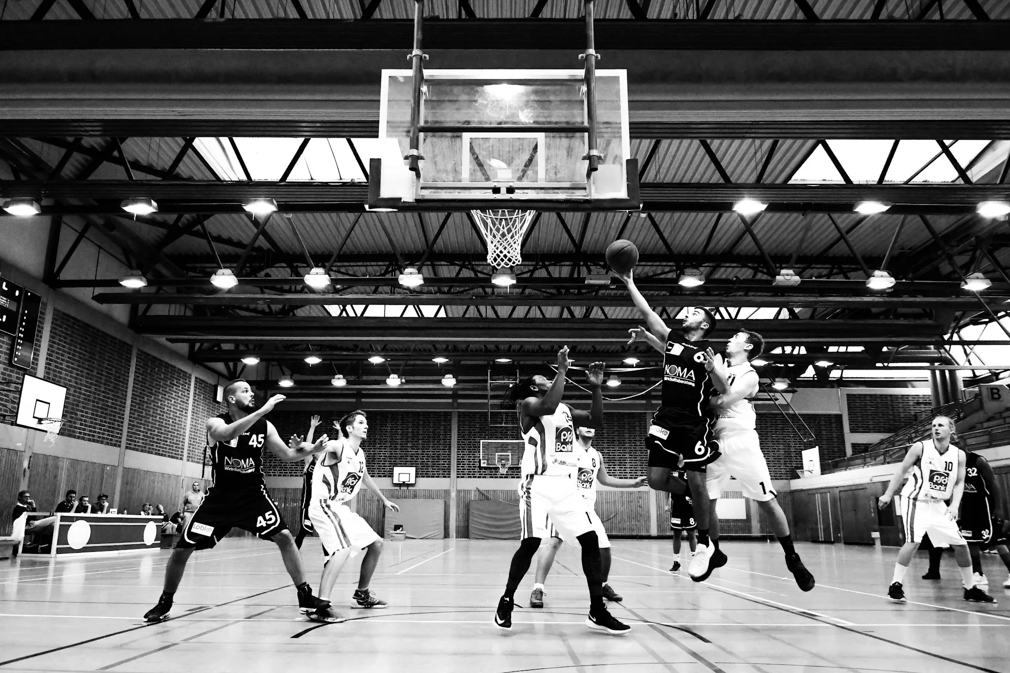 Players contesting a rebound during a game