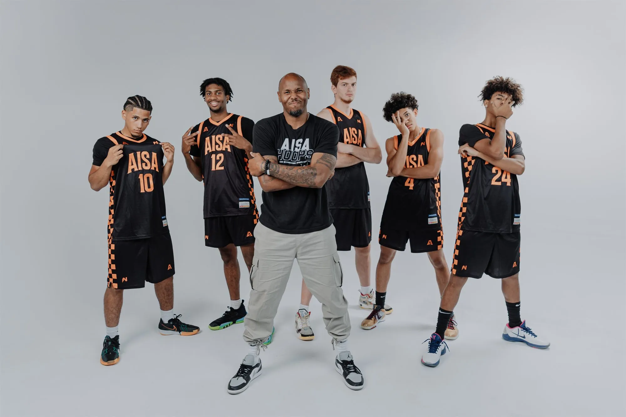 Apex ISA coach and student-athletes in AISA uniforms
